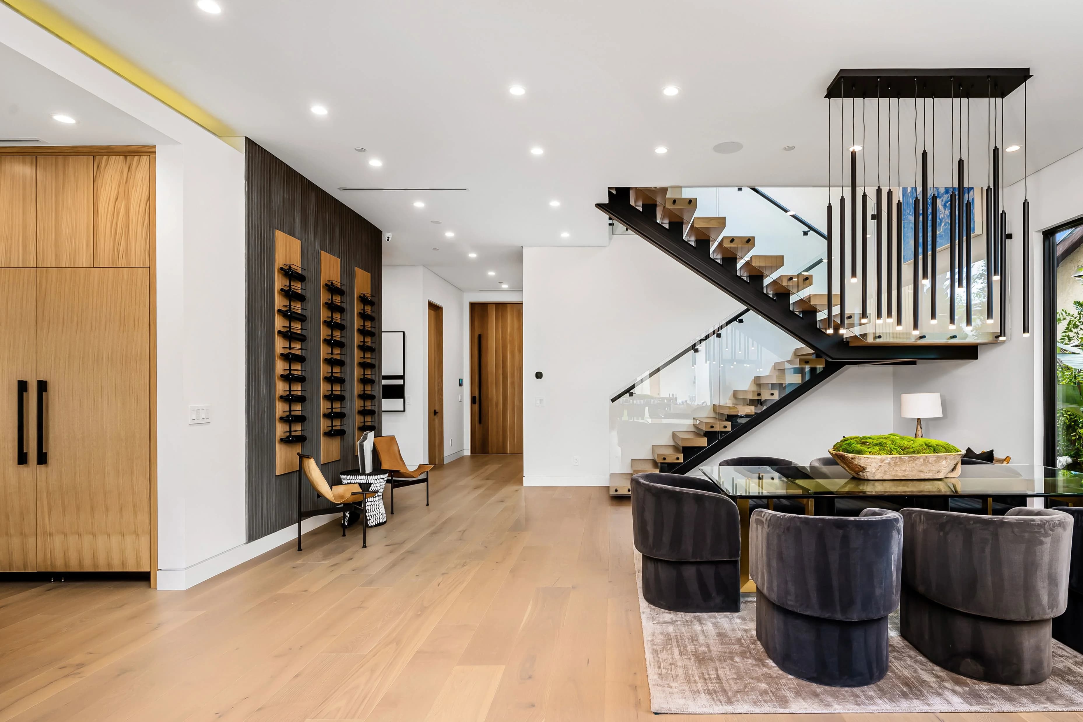 Bright open-plan interior with a floating staircase